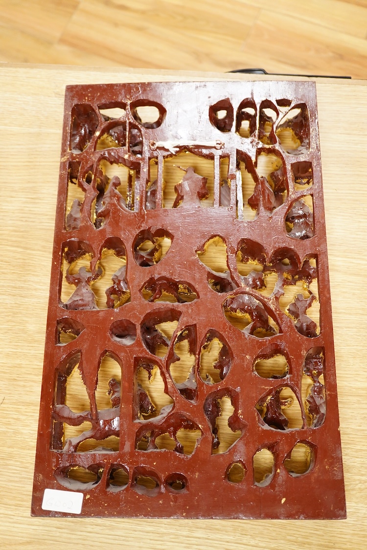 A Chinese carved gilt wood panel, depicting battle scenes, 50cm high